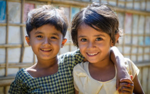 Children whose families are served by the Rohingya Camp 19 World Vision community kitchen play outside in the refugee camp. Rohingya Refugee Camps, Cox’s Bazar, Bangladesh.