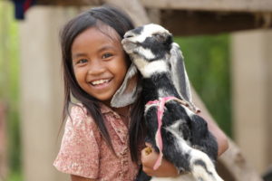 girl thankful for goat