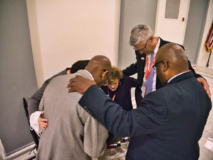 leaders pray together